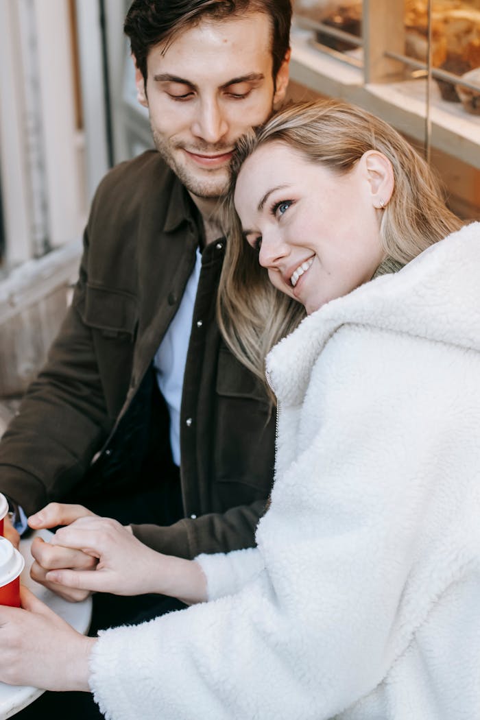hero-img-02 High angle of happy young couple in casual wear spending romantic date in cafe